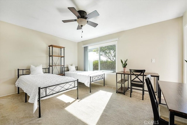 bedroom with light carpet and ceiling fan