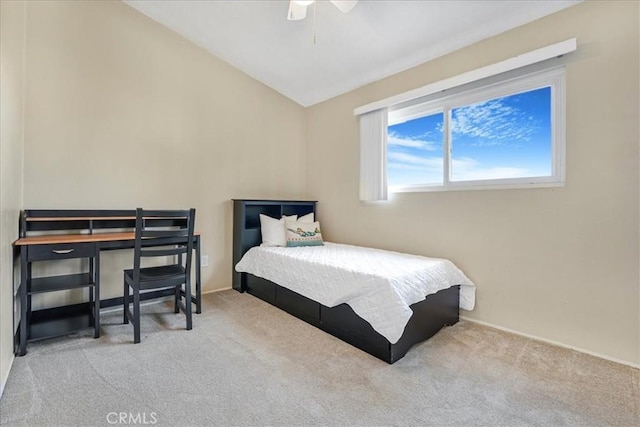 carpeted bedroom featuring vaulted ceiling and ceiling fan