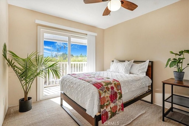 carpeted bedroom with access to exterior and ceiling fan