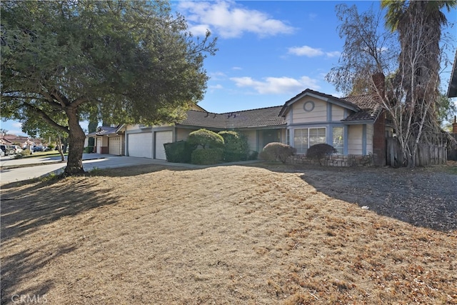 single story home featuring a garage