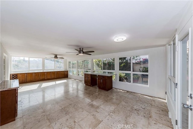 unfurnished sunroom featuring a healthy amount of sunlight