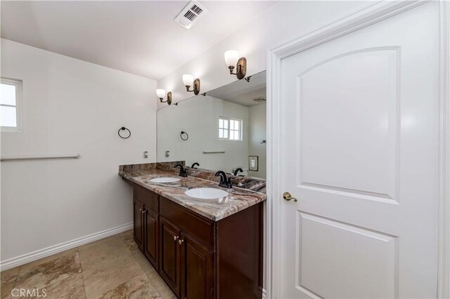 bathroom featuring vanity and plenty of natural light