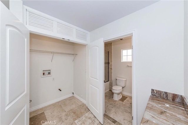 laundry room with hookup for a washing machine, laundry area, and baseboards