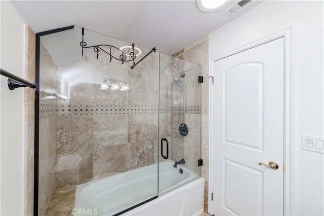 full bathroom with visible vents and bath / shower combo with glass door