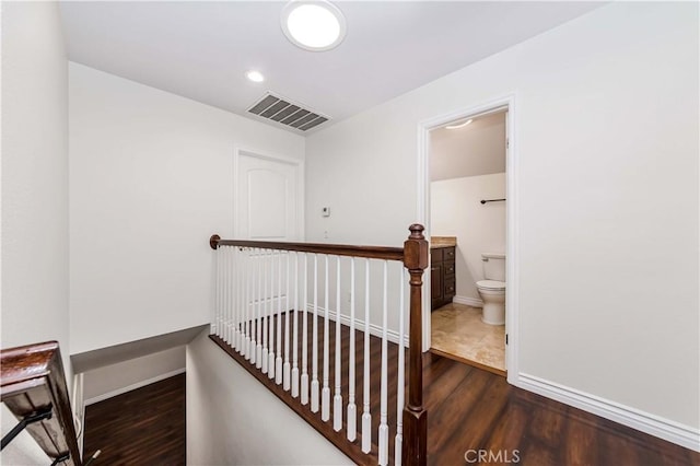 interior space featuring recessed lighting, visible vents, baseboards, and wood finished floors