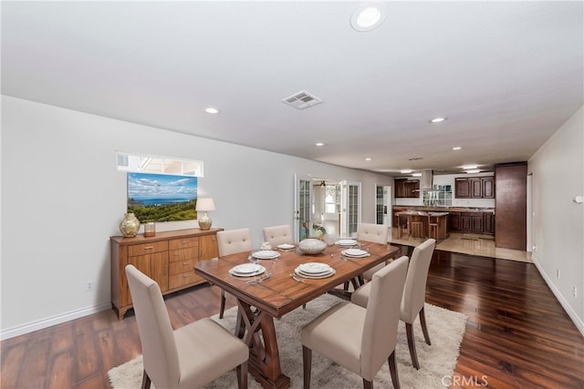 dining space with baseboards, dark wood-style flooring, visible vents, and recessed lighting