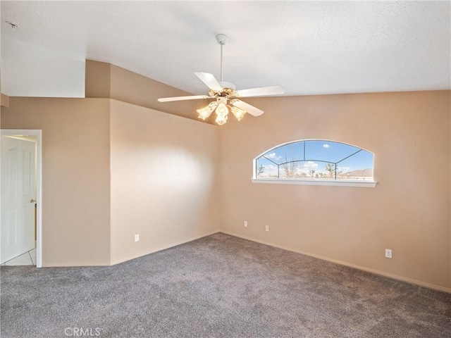 empty room featuring carpet flooring and ceiling fan