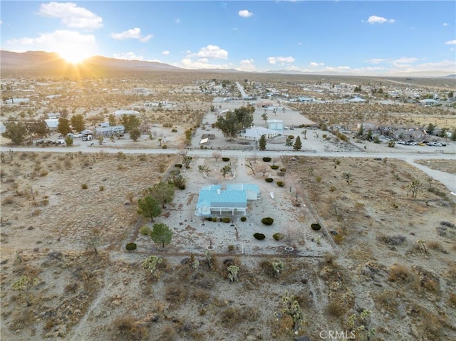 birds eye view of property featuring a mountain view