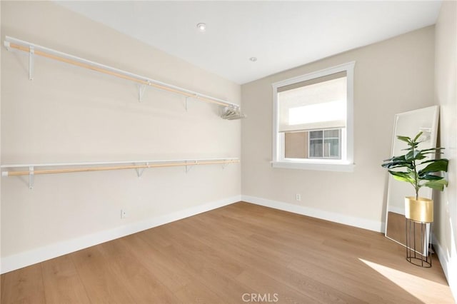 walk in closet featuring light hardwood / wood-style floors