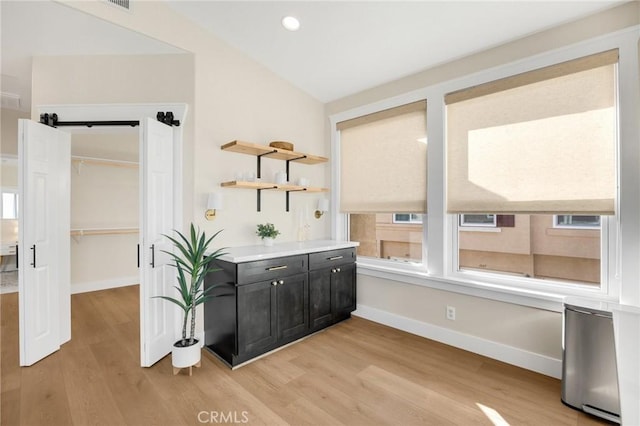 interior space with lofted ceiling and hardwood / wood-style floors