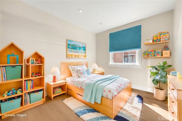 bedroom with wood-type flooring