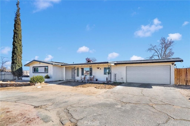 ranch-style home featuring a garage