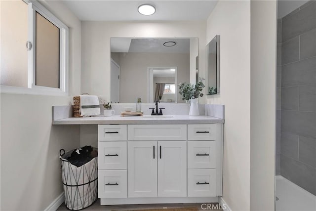 bathroom featuring vanity and a shower