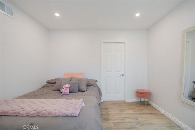 bedroom with light hardwood / wood-style flooring