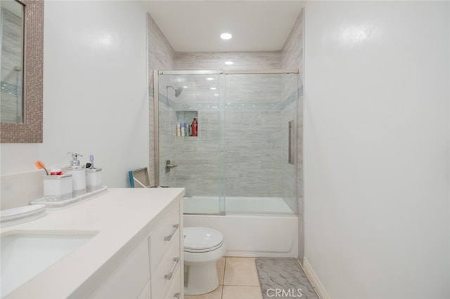 full bathroom with vanity, toilet, tile patterned flooring, and combined bath / shower with glass door