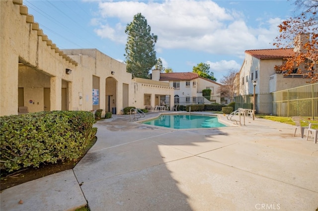 view of pool featuring a patio