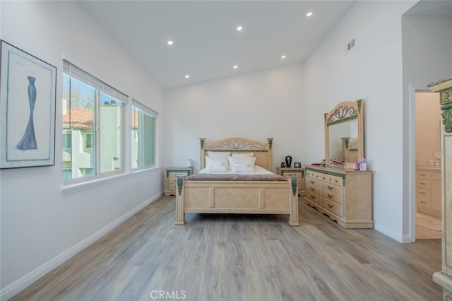 bedroom with light hardwood / wood-style floors