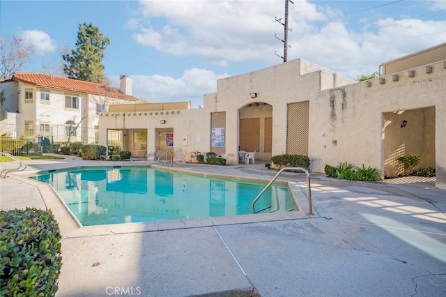 view of swimming pool with a patio