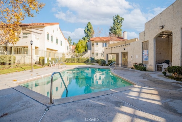 view of swimming pool with a patio area