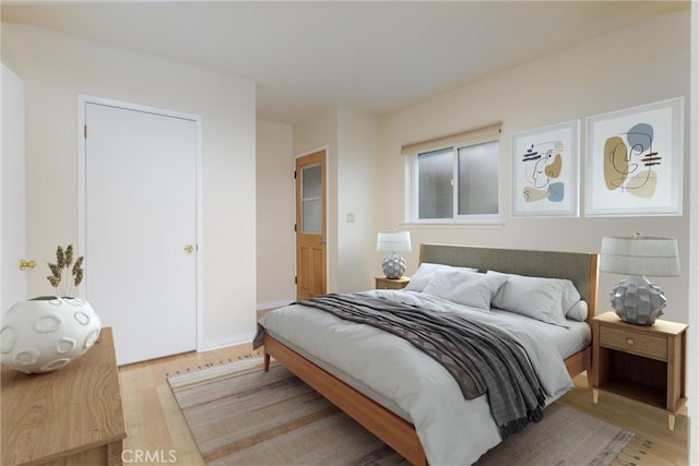 bedroom with light hardwood / wood-style floors