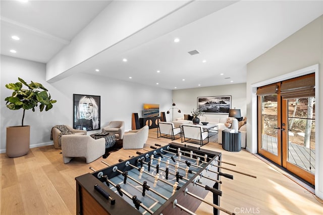 2335 Hillview Dr, Laguna Beach, CA 92651 - recreation room featuring wood finished floors, recessed lighting, and french doors
