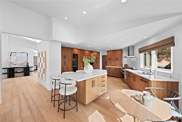 2335 Hillview Dr, Laguna Beach, CA 92651 - kitchen with high end stainless steel range, a spacious island, modern cabinets, wall chimney exhaust hood, and recessed lighting