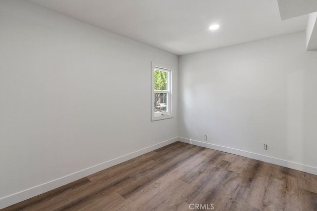 unfurnished room featuring wood-type flooring