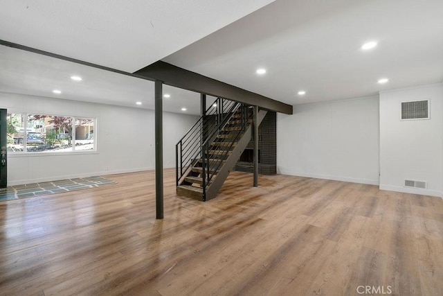 basement featuring wood-type flooring