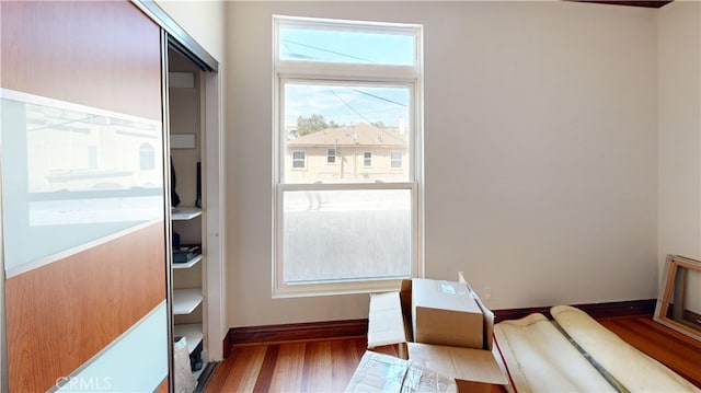 doorway with hardwood / wood-style floors