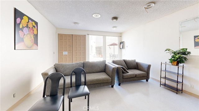 living room with a textured ceiling