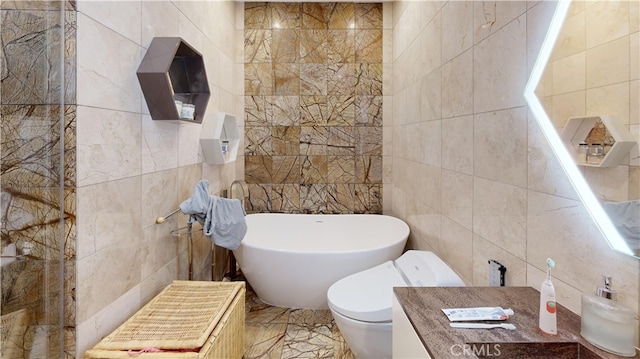 bathroom with tile walls, a tub, and toilet