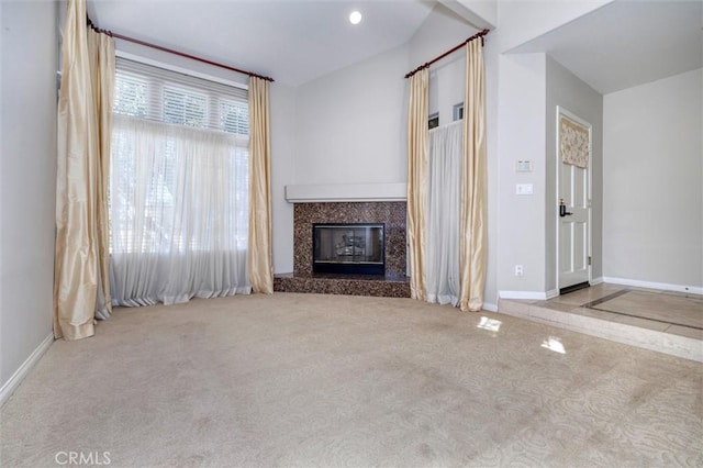 unfurnished living room with a fireplace and light colored carpet