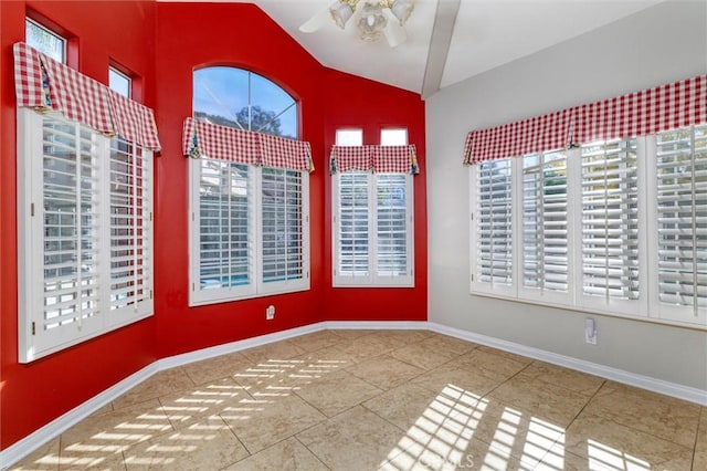 spare room featuring tile patterned flooring, ceiling fan, and high vaulted ceiling