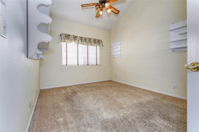 carpeted empty room featuring lofted ceiling and ceiling fan