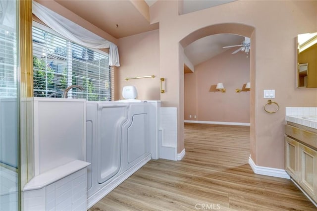 bathroom featuring vanity, hardwood / wood-style floors, and ceiling fan