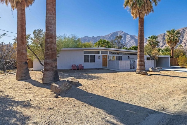 view of front of home featuring a mountain view