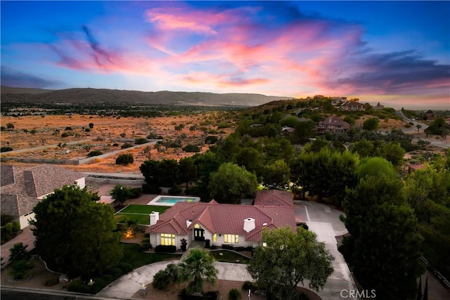 aerial view at dusk with a mountain view