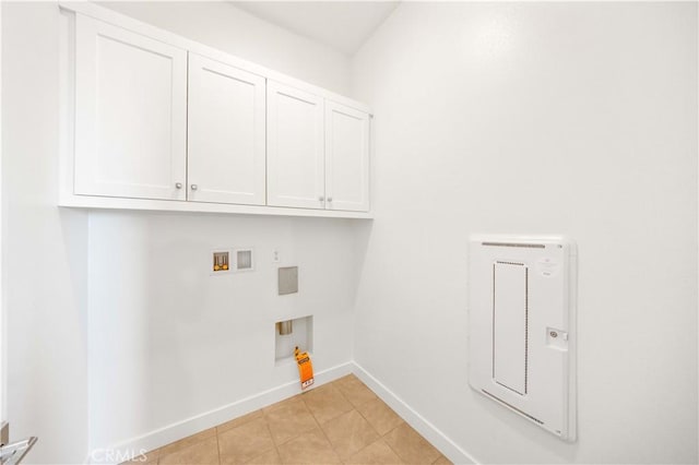 laundry room featuring light tile patterned floors, washer hookup, cabinets, and hookup for an electric dryer