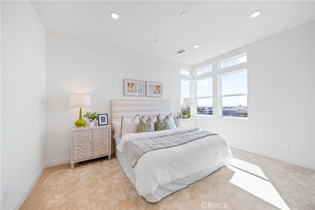 bedroom with light colored carpet