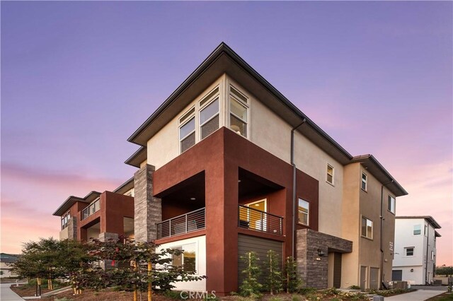 view of outdoor building at dusk