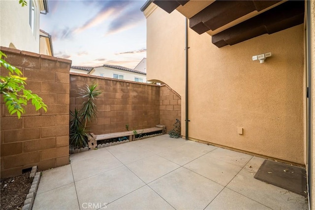 view of patio terrace at dusk