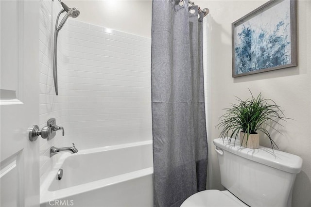 bathroom featuring toilet and shower / bathtub combination with curtain