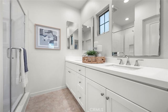 bathroom featuring vanity, tile patterned floors, and a shower with door