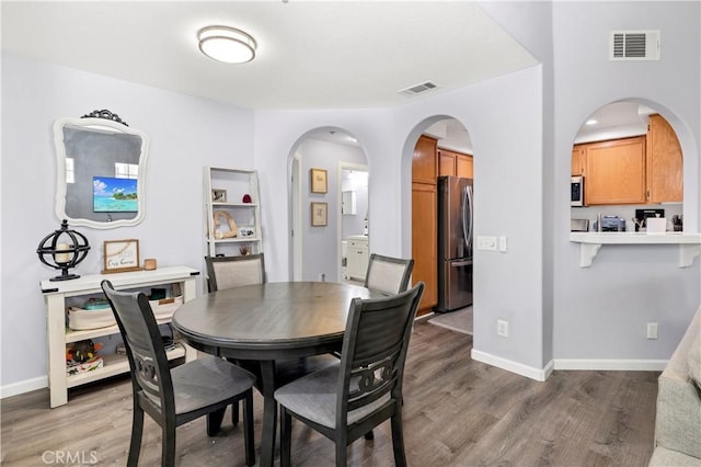 dining room with hardwood / wood-style flooring