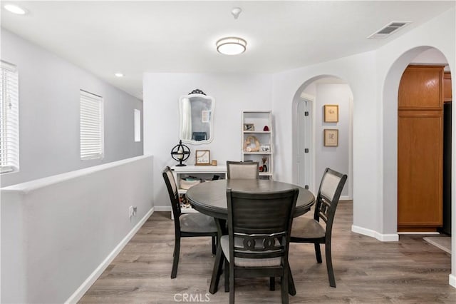 dining area featuring hardwood / wood-style floors