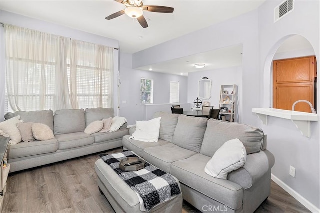 living room with hardwood / wood-style floors and ceiling fan