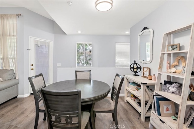 dining area with wood-type flooring