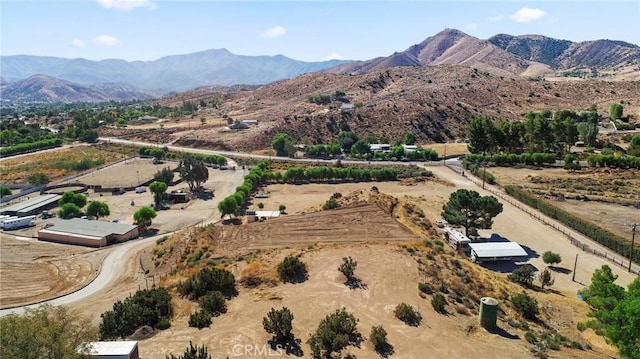 birds eye view of property featuring a mountain view