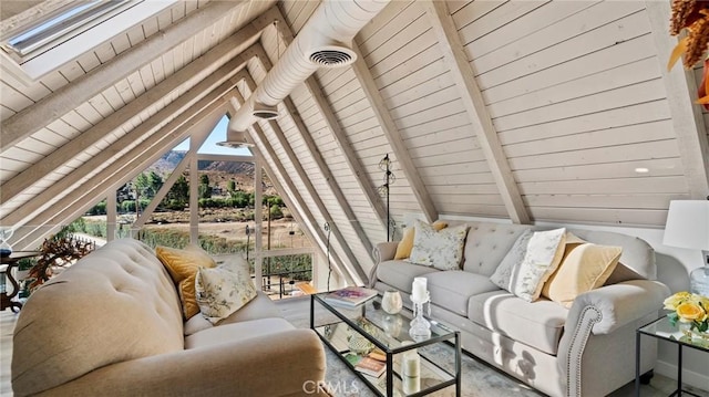 living room with lofted ceiling with beams and wooden ceiling