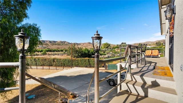 view of jungle gym featuring a mountain view